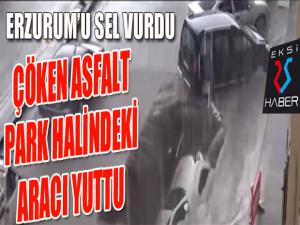 Karayolundaki göçük otomobili yuttu