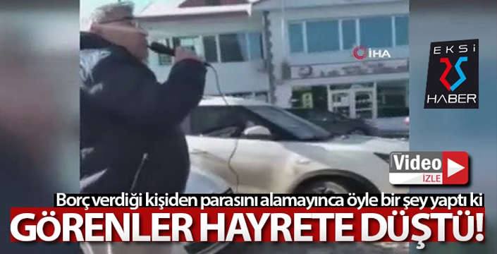 Alacaklısından megafonla parasını istedi, görenler hayrete düştü